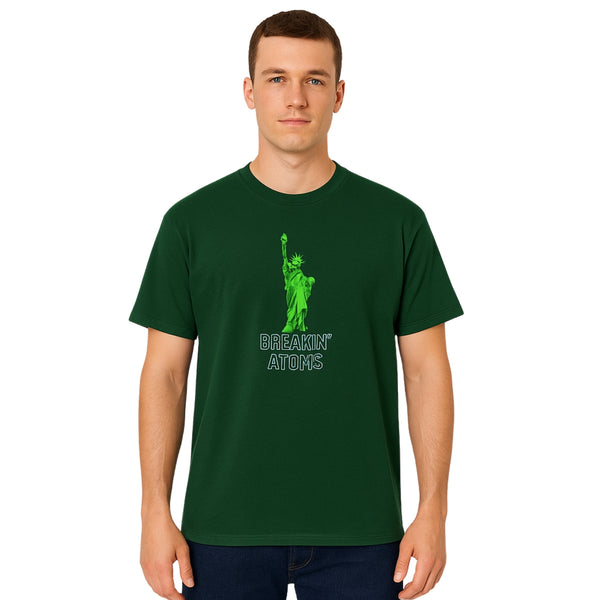 Model wearing Breakin' Atoms "Abraham Only Sees Green Tee," a bold graphic t-shirt featuring an artistic depiction of Abraham Lincoln with a focus on wealth, vision, and green-toned symbolism — a standout in creative streetwear.