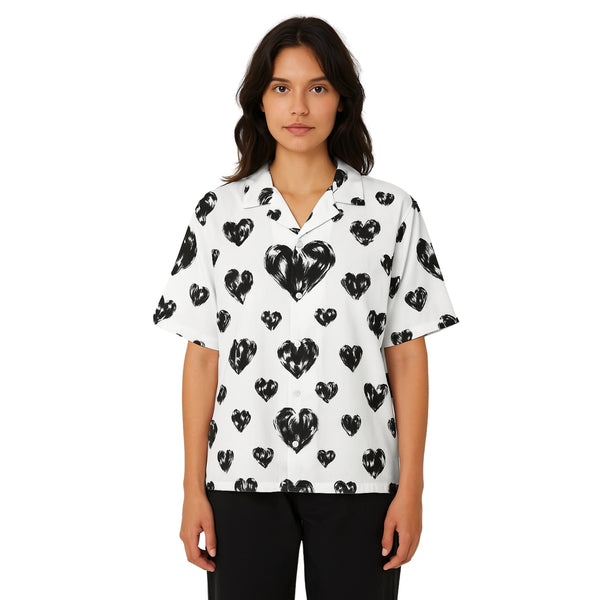 Model wearing Breakin' Atoms "Black Hearts Button-Up," a short sleeve shirt featuring an all-over dark heart motif on a sleek silhouette — blending romance and rebellion in elevated streetwear style.