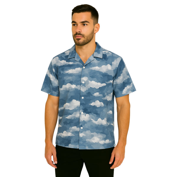 Model wearing Breakin' Atoms "Cloudspace Nimbus Button-Up," a short sleeve shirt with an abstract cloud-inspired blue and white gradient design — a dreamy yet structured summer statement piece.