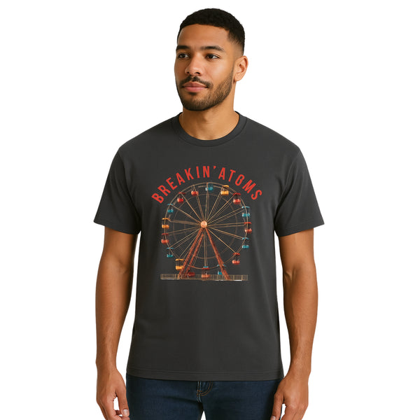 Model wearing Breakin’ Atoms "Ferris Wheel Tee" — a nostalgic graphic t-shirt featuring a stylized ferris wheel design, evoking amusement park vibes and a playful, retro aesthetic.