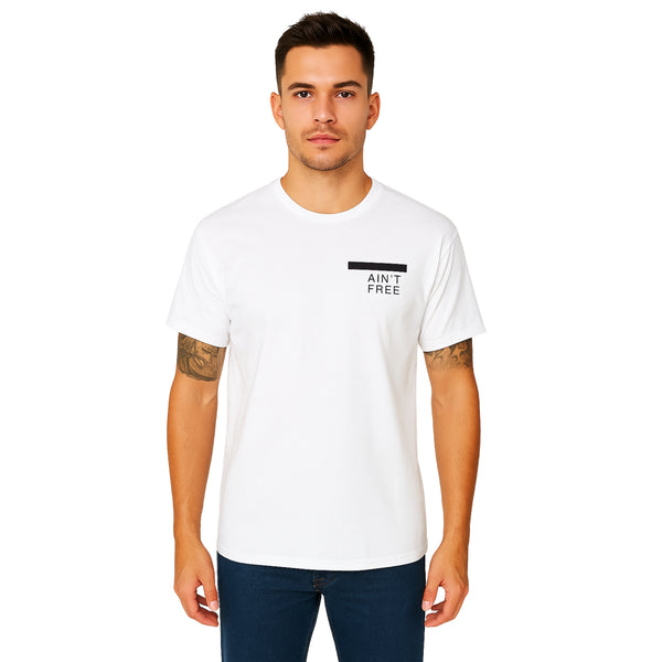 Model wearing Breakin' Atoms "Redacted Ain’t Free" Tee, a bold short sleeve t-shirt featuring censored text design that makes a powerful social statement — ideal for politically conscious streetwear.