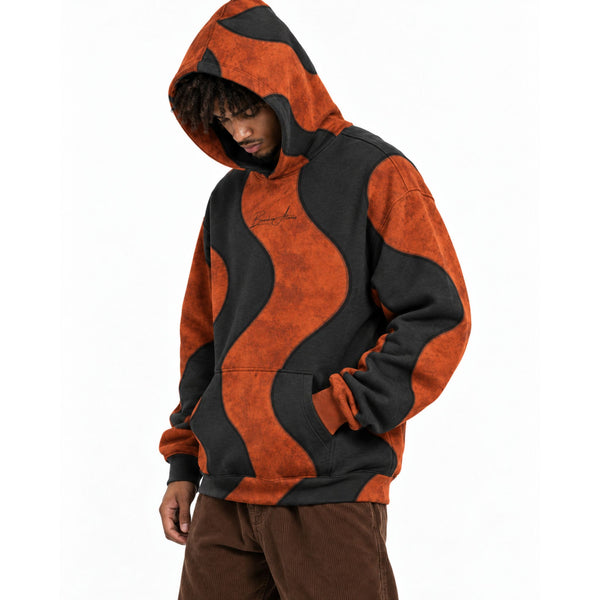 Model wearing the Breakin' Atoms Side Effects Hoodie, hood up, hands in the front pocket, burnt rust and washed black waves