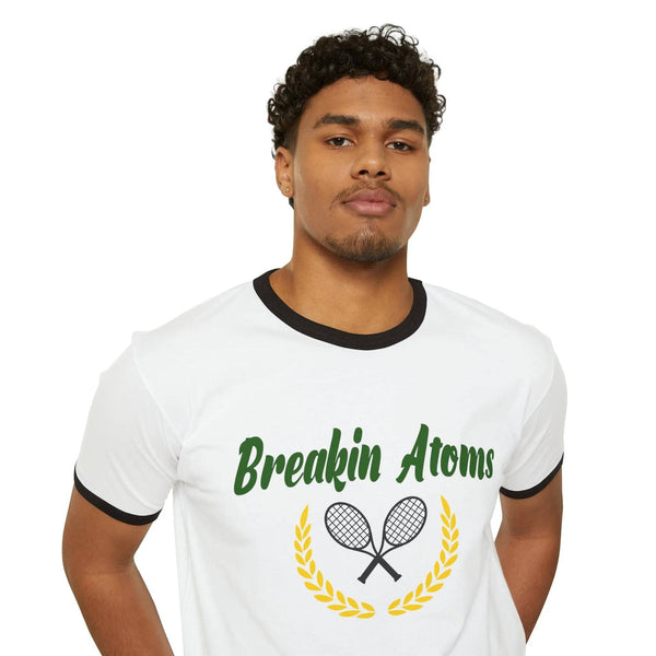 Breakin' Atoms Tennis Hills Ringed Tee - BREAKIN' ATOMSModel wearing Breakin' Atoms "Tennis Hills Ringed Tee," a vintage-style ringer t-shirt with contrast neckline and sleeve hems, featuring a scenic tennis hills graphic — blending sport heritage with casual lifestyle wear.