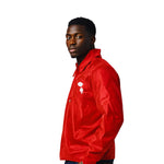 Model wearing the Breakin' Atoms Coach's Jacket in red satin, showing side profile. Features the Getaway Man logo on the chest, representing risk and reward. thumbnail 5