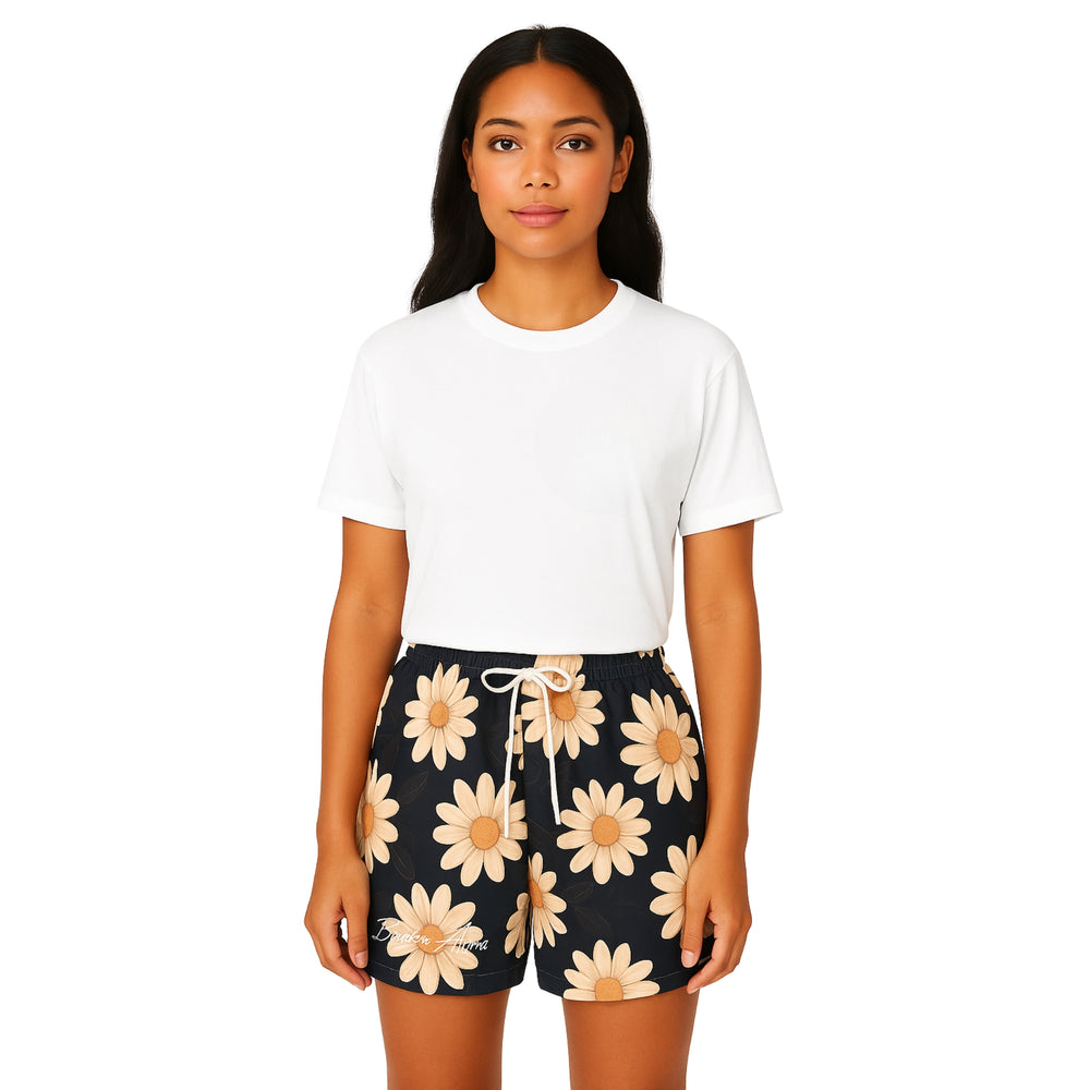 Breakin' Atoms "Daisy Dream Swim Trunks" featuring an all-over light daisy floral print on a dark background with white drawstrings — lightweight and breathable for warm weather, beachwear, or poolside lounging. — Breakin Atoms premium streetwear