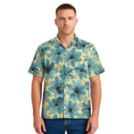 Model wearing Breakin' Atoms "Daisy Mosaic Vacation Button-Up," a lightweight short sleeve shirt with all-over abstract daisy floral print and relaxed fit — ideal for tropical getaways and summer street style. thumbnail 1