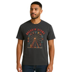Model wearing Breakin’ Atoms "Ferris Wheel Tee" — a nostalgic graphic t-shirt featuring a stylized ferris wheel design, evoking amusement park vibes and a playful, retro aesthetic.
 thumbnail 1