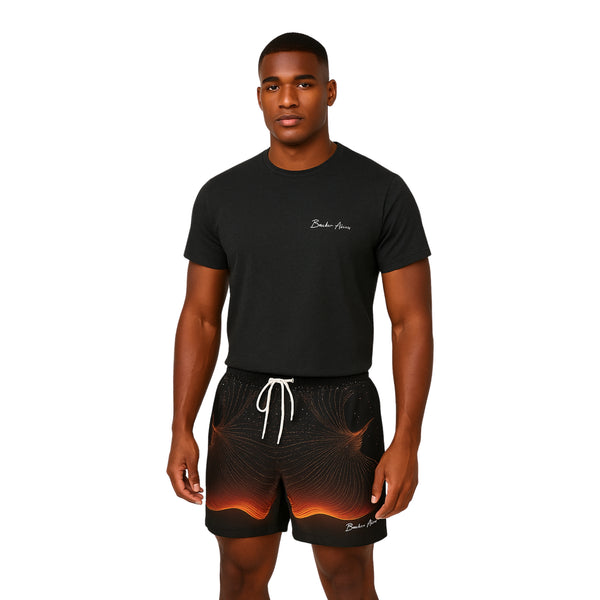 Model wearing Breakin' Atoms "Fiery Phoenix Shorts," black athletic-fit shorts featuring a vibrant rising phoenix graphic in red and orange — symbolizing power, rebirth, and unstoppable energy.