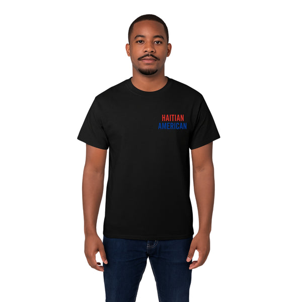 Model wearing Breakin' Atoms "Haitian American Tee," a short sleeve graphic shirt combining the Haitian and American flags in a bold, unified design that celebrates dual heritage and cultural pride.