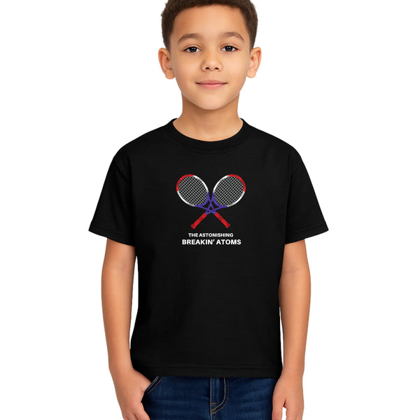 Child model wearing Breakin' Atoms Kid's Tennis Tee in black, featuring crossed tennis rackets and bold text design — a fun, sporty graphic t-shirt perfect for active kids and tennis fans.