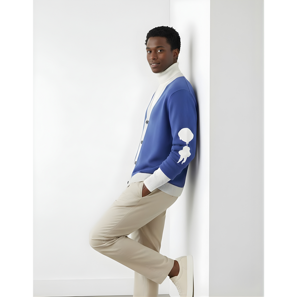 “Breakin’ Atoms L Cloud Thread Cardigan in blue with cream ribbed collar, cuffs, and hem, button-front knit cardigan featuring a white sleeve logo graphic, shown on model in side profile.”