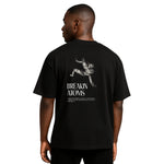 Model wearing Breakin' Atoms "Leap of Fate Shirt" — a conceptual graphic tee featuring surreal art that captures a bold jump into the unknown, symbolizing courage, transformation, and forward motion in streetwear form. thumbnail 1