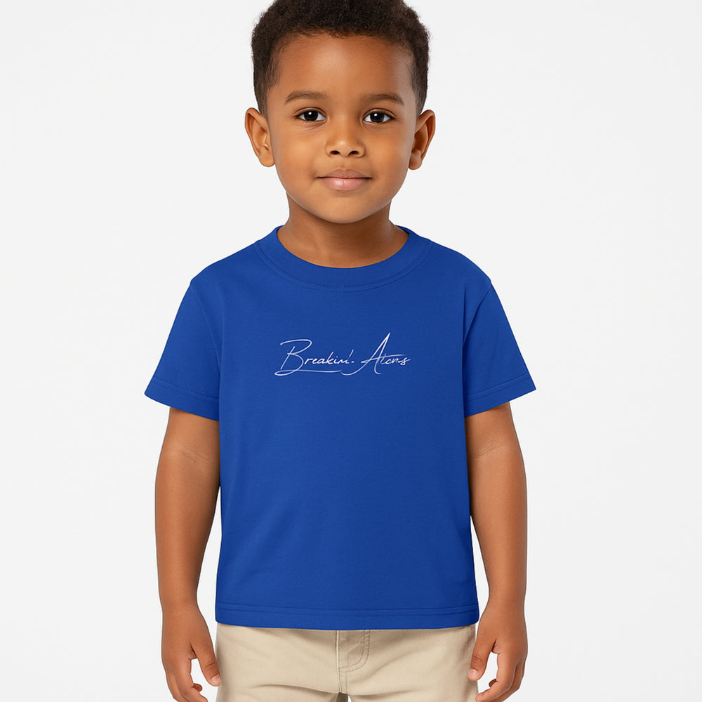 Child wearing Breakin' Atoms "The Little Voyager Tee," a kids’ graphic t-shirt featuring a whimsical space travel design that celebrates curiosity, creativity, and big dreams. — Breakin Atoms premium streetwear