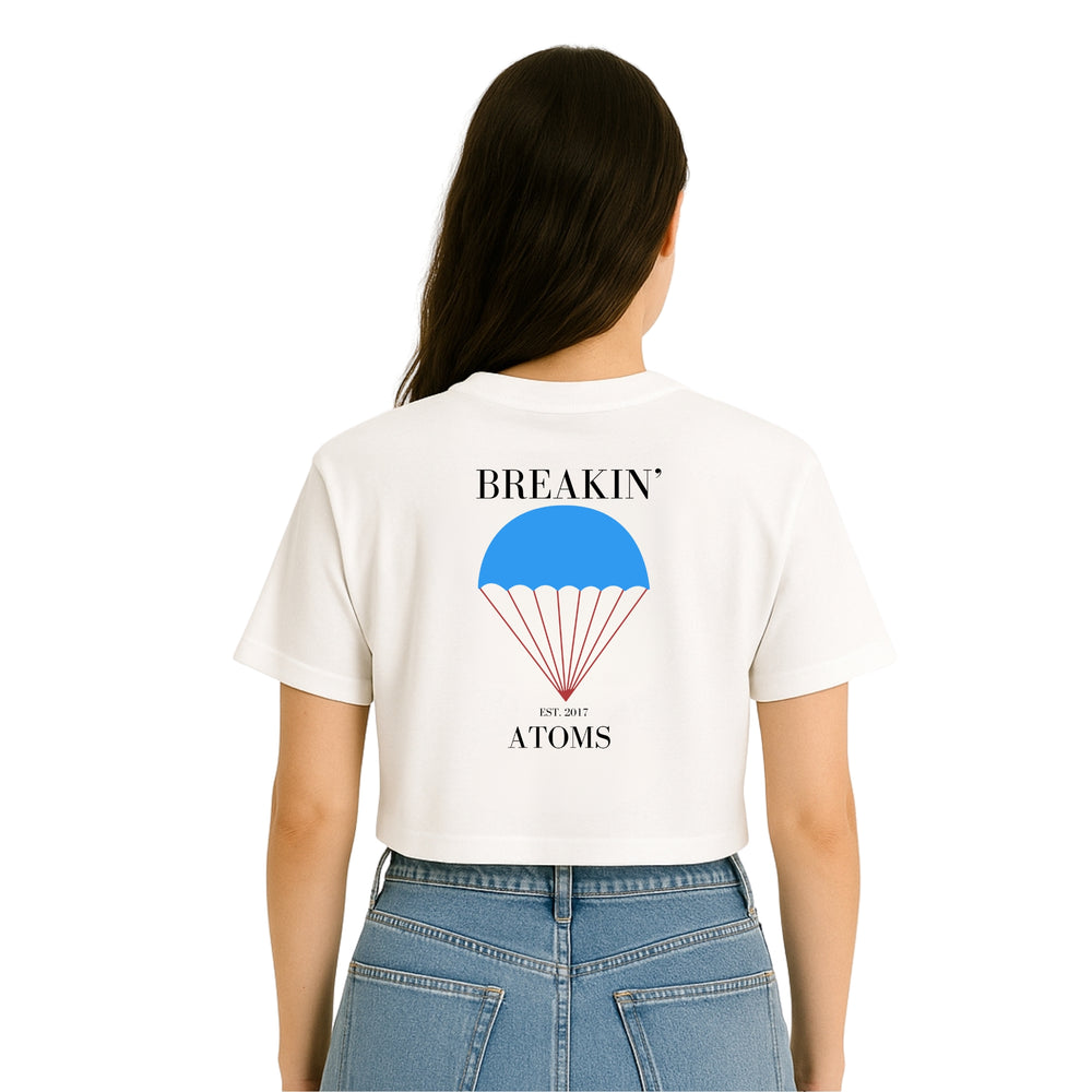 Back of Breakin' Atoms "Parachute Monogram Women's Crop Tee" highlighting the cropped silhouette and minimal finish — designed for versatile everyday wear with a bold streetwear edge. — Breakin Atoms premium streetwear