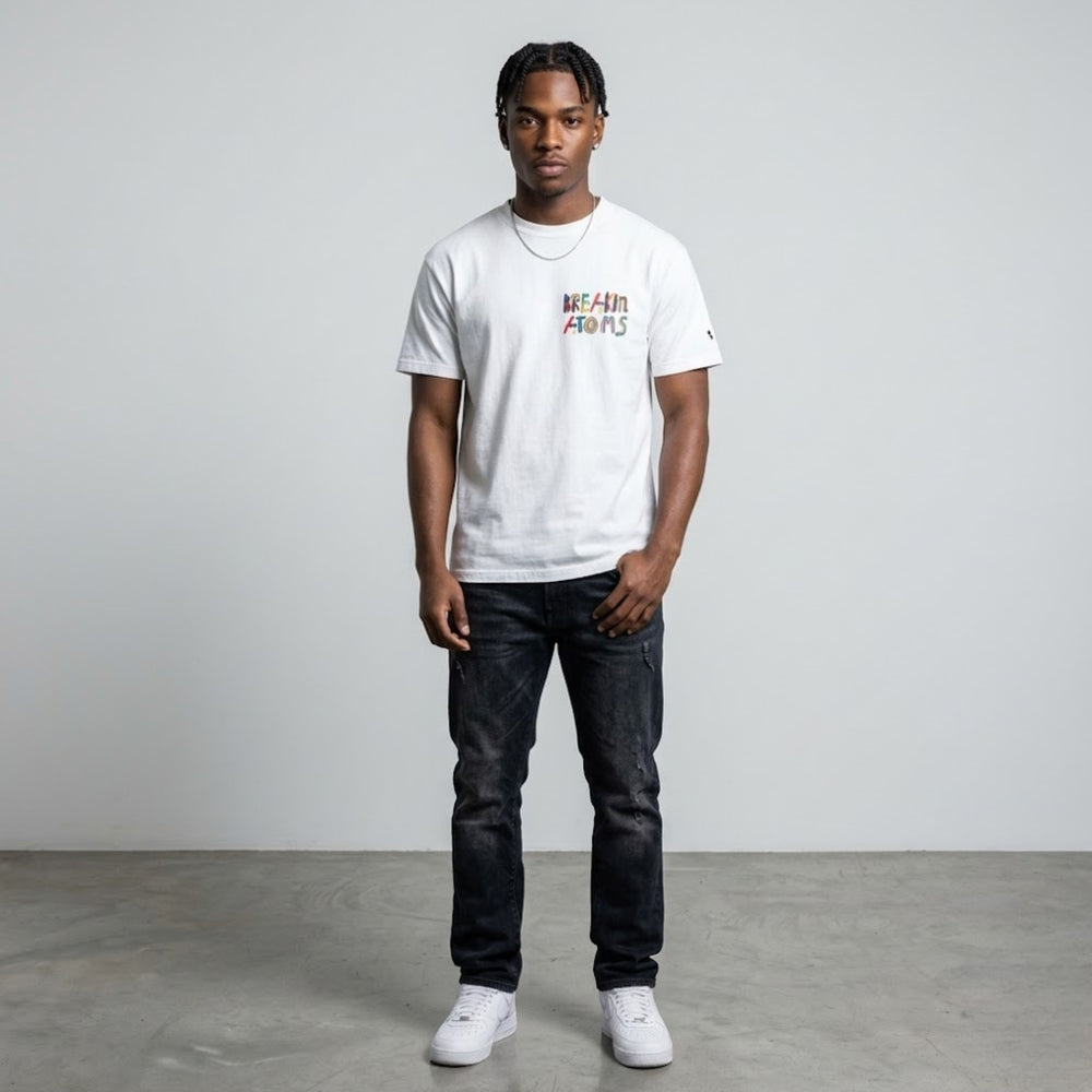  Save your self tee from Breakin' Atoms white graphic t-shirt shown from the back with large colorful no one is coming to save us text print.
 — Breakin Atoms premium streetwear