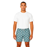 Model wearing Breakin' Atoms "Star-Spangled Shorts," featuring a bold navy blue and cream color block design with scattered star prints — a modern twist on patriotic fashion perfect for summer and festival wear. thumbnail 1