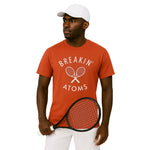 Model wearing Breakin' Atoms Tennis Shirt in red, featuring an athletic fit, performance fabric, and classic polo collar — perfect for tennis or casual sport-inspired streetwear. thumbnail 1